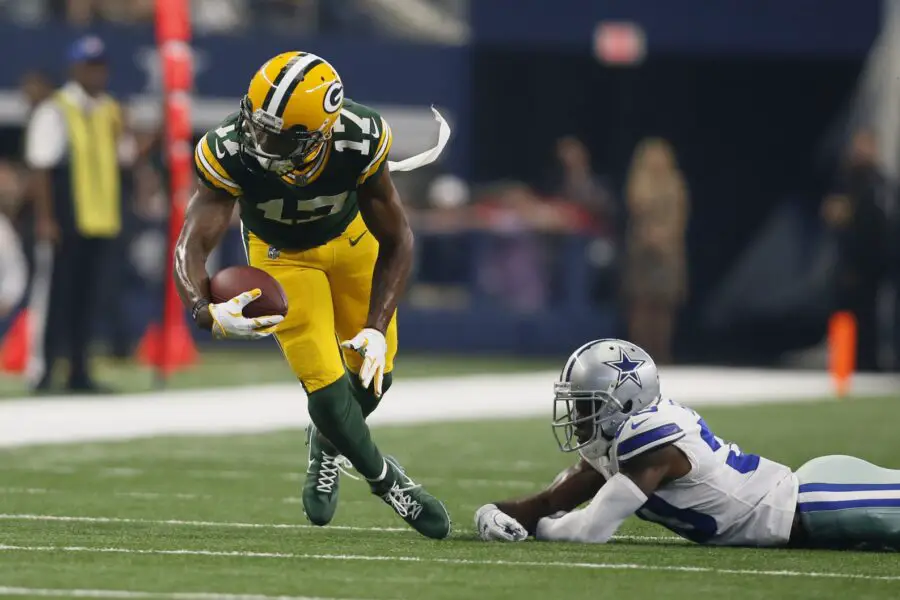 Oct 8, 2017; Arlington, TX, USA; Green Bay Packers wide receiver Davante Adams (17) runs after avoiding a tackle by Dallas Cowboys cornerback Anthony Brown (30) in the second quarter at AT&T Stadium. Mandatory Credit: Tim Heitman-USA TODAY Sports