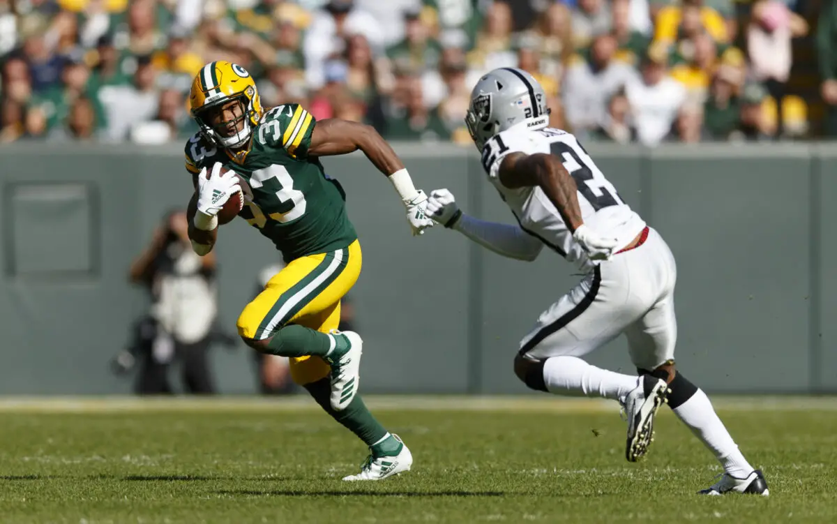 Oct 20, 2019; Green Bay, WI, USA; Green Bay Packers running back Aaron Jones (33) rushes with the football during the first quarter against the Oakland Raiders at Lambeau Field. Mandatory Credit: Jeff Hanisch-USA TODAY