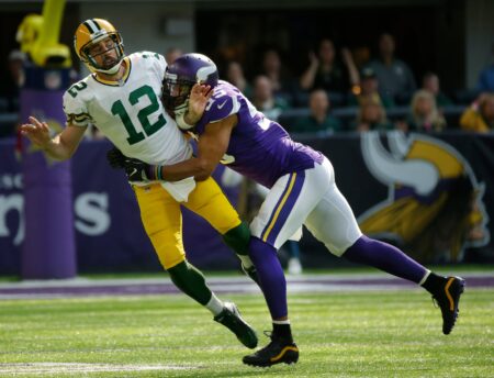 Green Bay Packers quarterback Aaron Rodgers is sacked by Anthony Barr