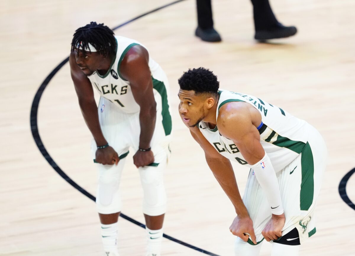 Jul 8, 2021; Phoenix, Arizona, USA; Milwaukee Bucks forward Giannis Antetokounmpo (34) and guard Jrue Holiday (21) against the Phoenix Suns in game two of the 2021 NBA Finals at Phoenix Suns Arena. Mandatory Credit: Mark J. Rebilas-USA TODAY Sports