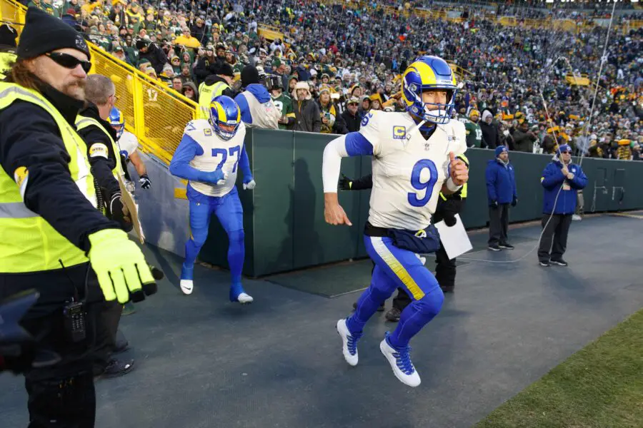 Nov 28, 2021; Green Bay, Wisconsin, USA; Los Angeles Rams quarterback Matthew Stafford (9) runs onto the field prior to the game against the Green Bay Packers at Lambeau Field. Mandatory Credit: Jeff Hanisch-USA TODAY Sports