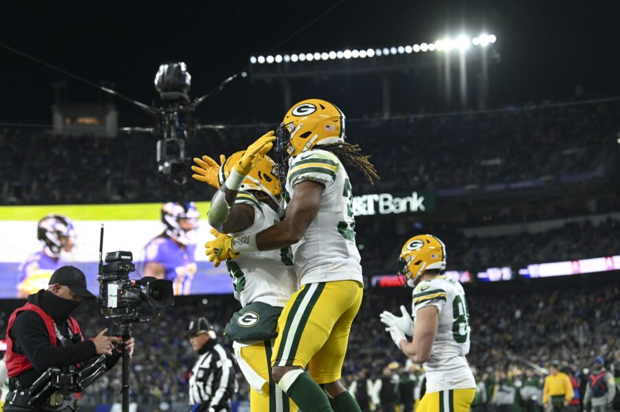 Dec 19, 2021; Baltimore, Maryland, USA; Green Bay Packers running back Aaron Jones (33) celebrates with wide receiver Juwann Winfree (88) after scoring a touchdown during the second half against the Baltimore Ravens at M&T Bank Stadium. Mandatory Credit: Tommy Gilligan-USA TODAY Sports