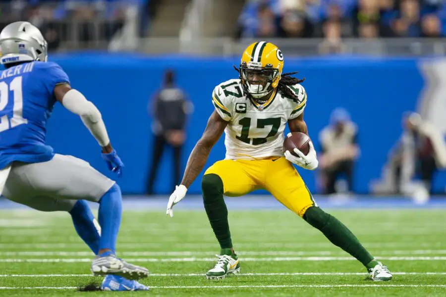 Jan 9, 2022; Detroit, Michigan, USA; Green Bay Packers wide receiver Davante Adams (17) runs after a catch against Detroit Lions free safety Tracy Walker III (21) during the second quarter at Ford Field. Mandatory Credit: Raj Mehta-USA TODAY Sports
