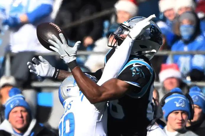 Dec 24, 2022; Charlotte, North Carolina, USA; Carolina Panthers wide receiver Terrace Marshall Jr. (88) catches the ball as Detroit Lions cornerback Jerry Jacobs (39) defends in the second quarter at Bank of America Stadium. Mandatory Credit: Bob Donnan-USA TODAY Sports (Green Bay Packers)
