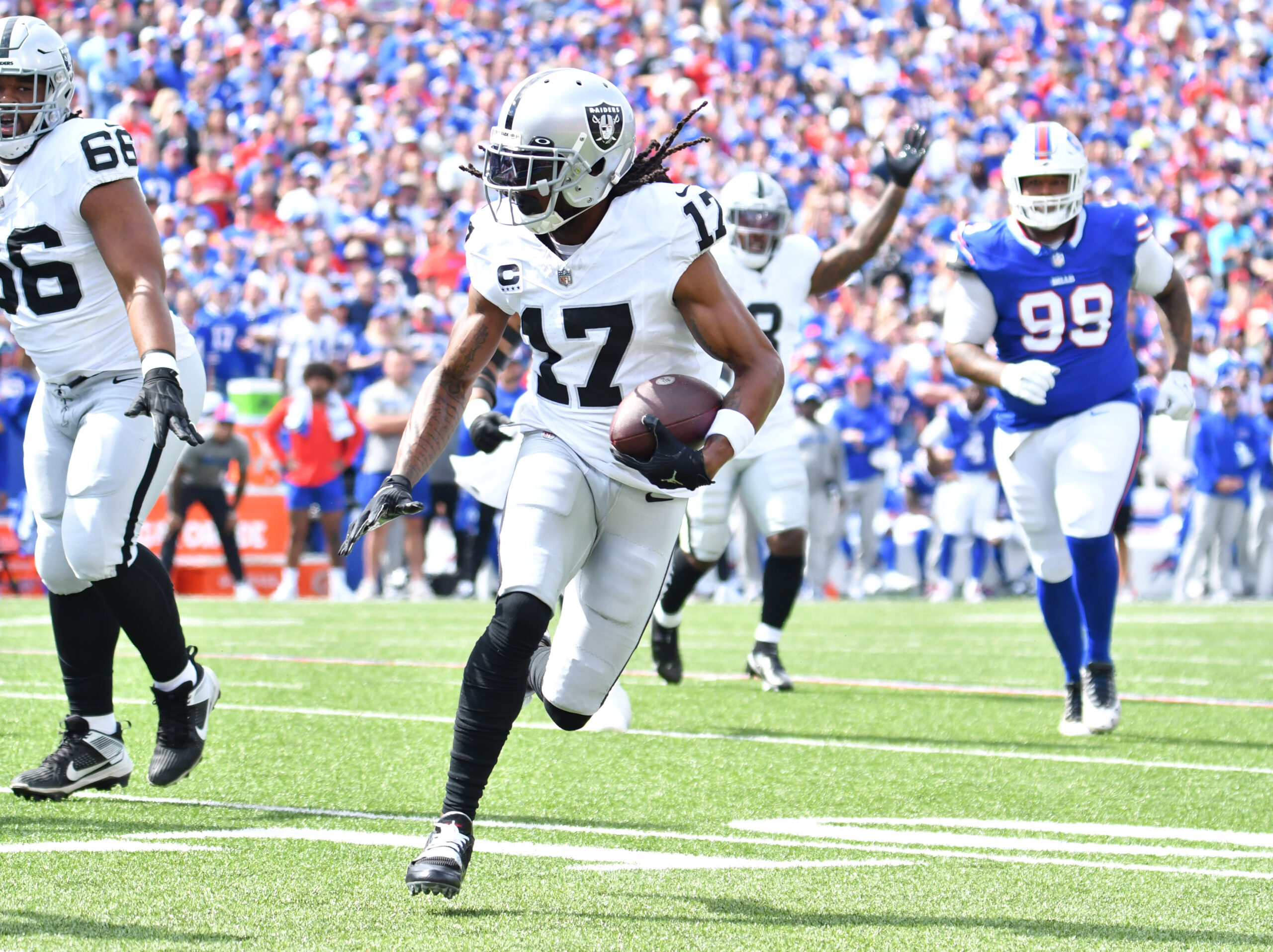 Sep 17, 2023; Orchard Park, New York, USA; Las Vegas Raiders wide receiver Davante Adams (17) runs for the end zone to score a touchdown in the first quarter against the Buffalo Bills at Highmark Stadium. Mandatory Credit: Mark Konezny-USA TODAY Sports