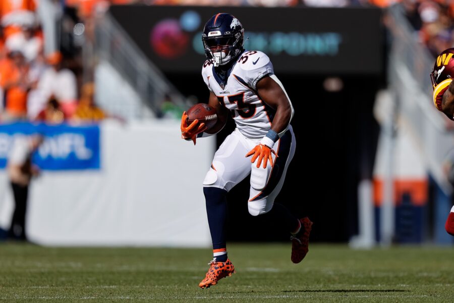 Sep 17, 2023; Denver, Colorado, USA; Denver Broncos running back Javonte Williams (33) runs the ball in the second quarter against the Washington Commanders at Empower Field at Mile High. Mandatory Credit: Isaiah J. Downing-USA TODAY Sports (Green Bay Packers)