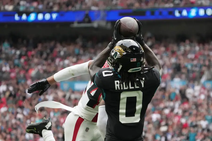 Oct 1, 2023; London, United Kingdom; Jacksonville Jaguars wide receiver Calvin Ridley (0) catches a 39-yard touchdown pass against Atlanta Falcons cornerback A.J. Terrell (24) in the first half during an NFL International Series game at Wembley Stadium. Mandatory Credit: Kirby Lee-USA TODAY Sports (Green Bay Packers)