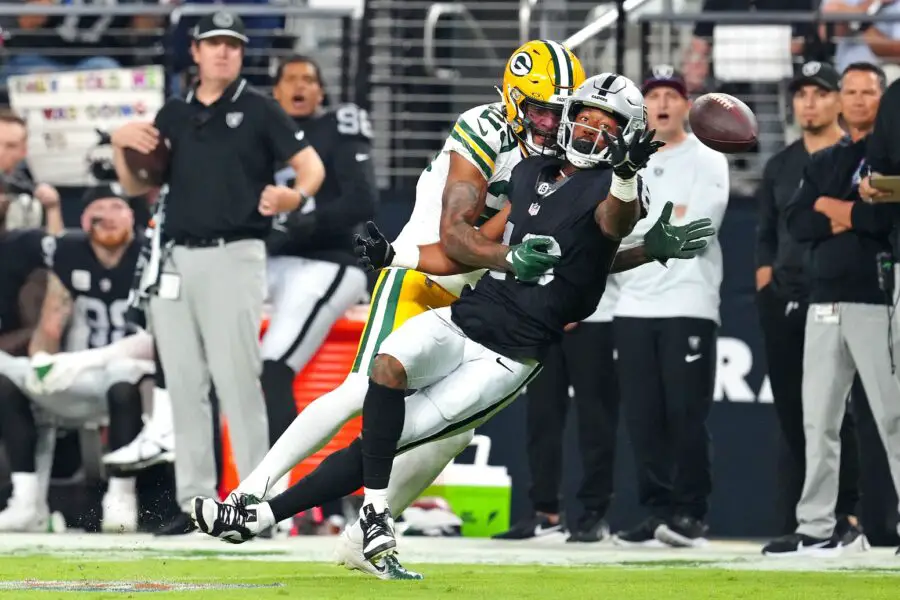 Oct 9, 2023; Paradise, Nevada, USA; Green Bay Packers cornerback Rasul Douglas (29) breaks up a pass intended for Las Vegas Raiders wide receiver Jakobi Meyers (16) during the first quarter at Allegiant Stadium. Mandatory Credit: Stephen R. Sylvanie-USA TODAY Sports