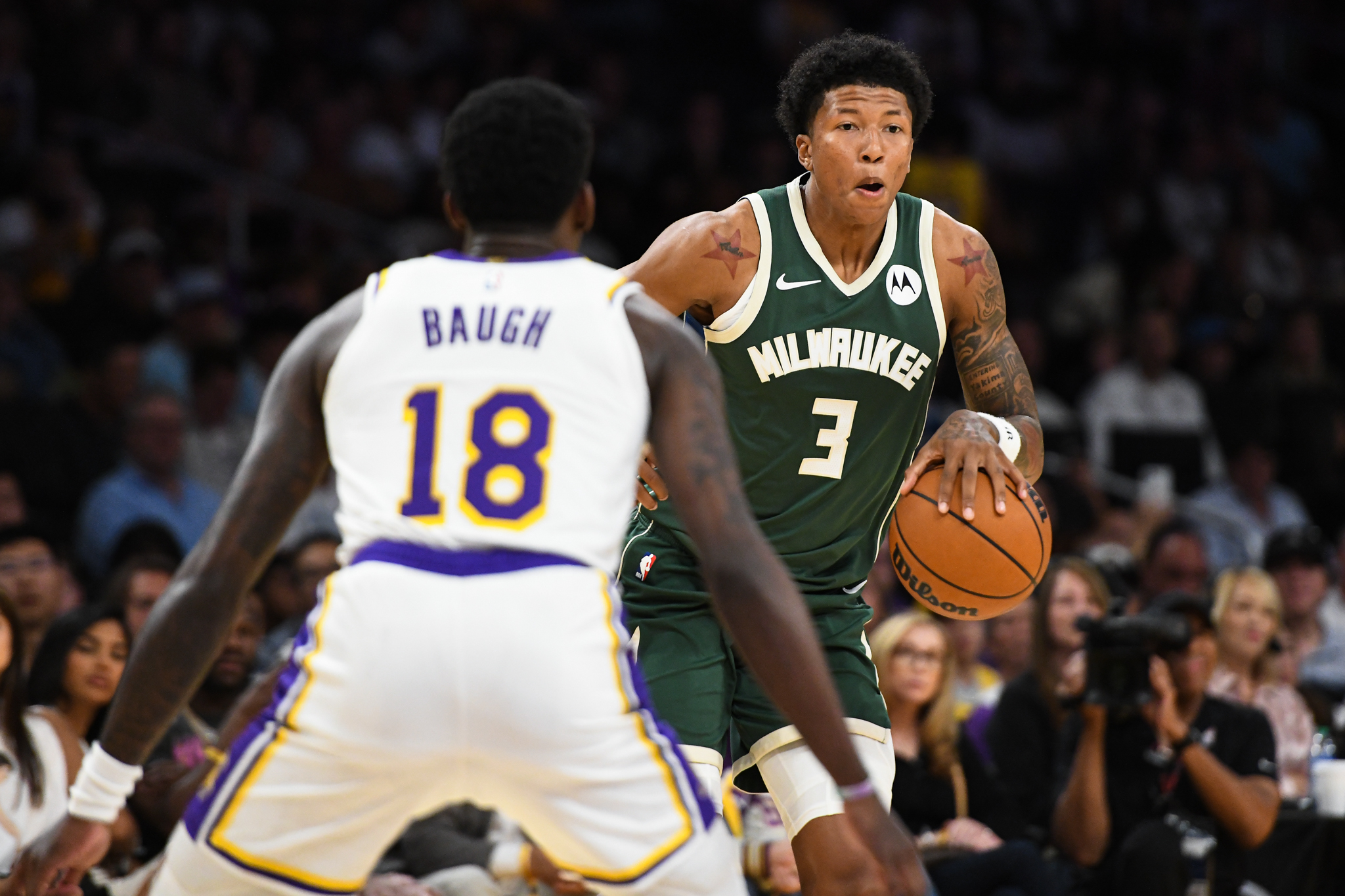 Oct 15, 2023; Los Angeles, California, USA; Milwaukee Bucks forward MarJon Beauchamp (3) moves the ball against Los Angeles Lakers guard Damion Baugh (18) during the second half at Crypto.com Arena. Mandatory Credit: Jonathan Hui-USA TODAY Sports
