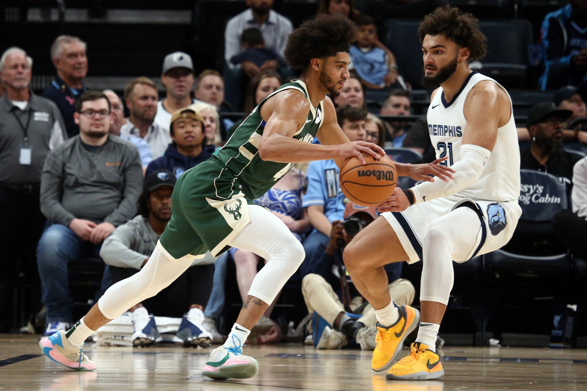Oct 10, 2023; Memphis, Tennessee, USA; Milwaukee Bucks guard Andre Jackson Jr. (44) drives to the basket as Memphis Grizzlies forward David Roddy (21) defends during the second half at FedExForum. Mandatory Credit: Petre Thomas-USA TODAY Sports