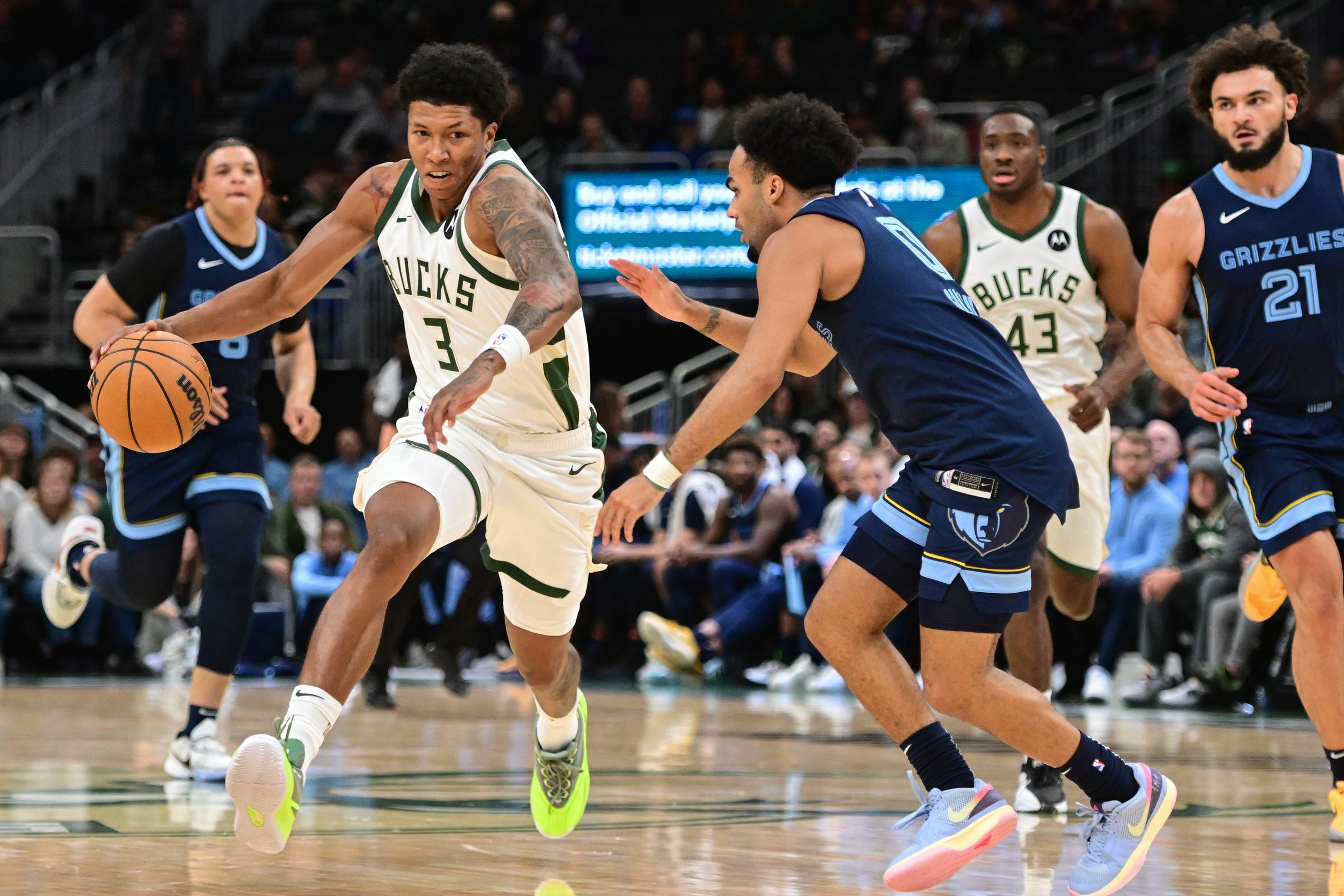 Oct 20, 2023; Milwaukee, Wisconsin, USA; Milwaukee Bucks center MarJon Beauchamp (3) drives for the basket against Memphis Grizzlies guard Jacob Gilyard (0) in the fourth quarter at Fiserv Forum. Mandatory Credit: Benny Sieu-USA TODAY Sports