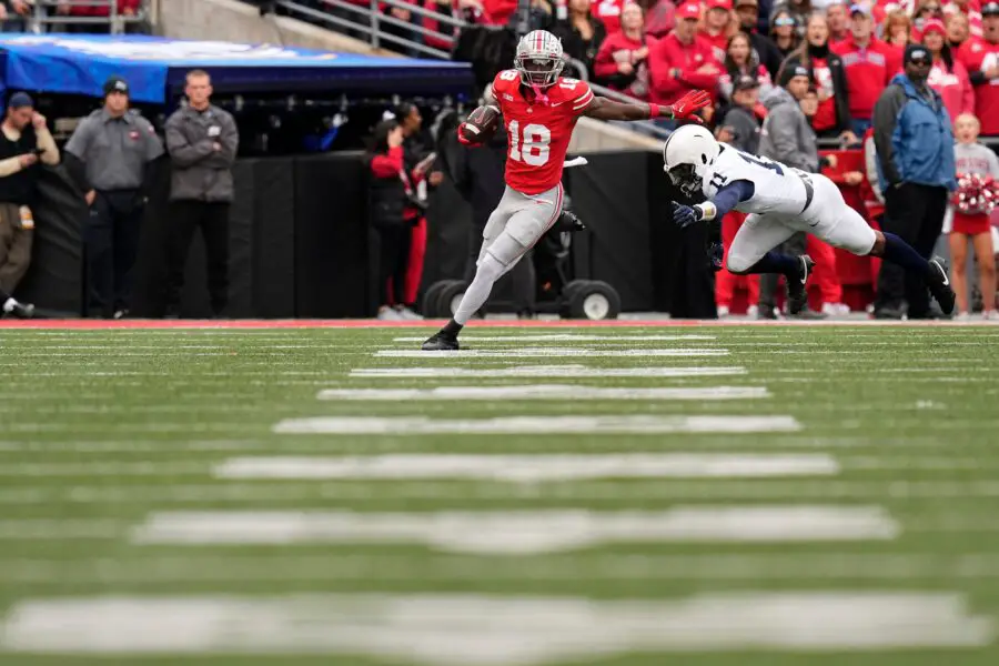 Oct 21, 2023; Columbus, Ohio, USA; Ohio State Buckeyes wide receiver Marvin Harrison Jr. (18) catches a pass in front of Penn State Nittany Lions linebacker Abdul Carter (11) during the second half of the NCAA football game at Ohio Stadium. Ohio State won 20-12. (Green Bay Packers)