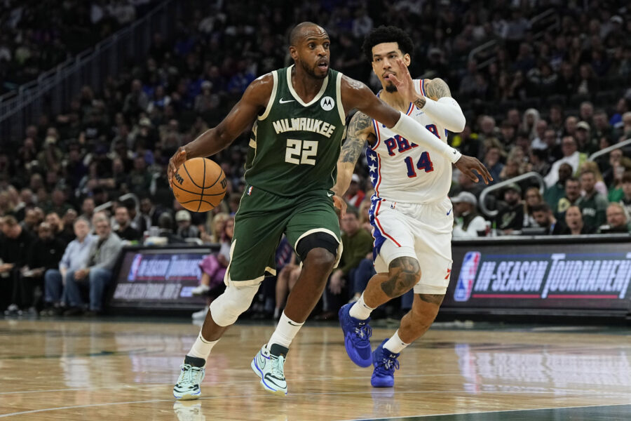 Oct 26, 2023; Milwaukee, Wisconsin, USA; Milwaukee Bucks forward Khris Middleton (22) drives for the basket in front of Philadelphia 76ers guard Danny Green (14) during the first quarter at Fiserv Forum. Mandatory Credit: Jeff Hanisch-USA TODAY Sports