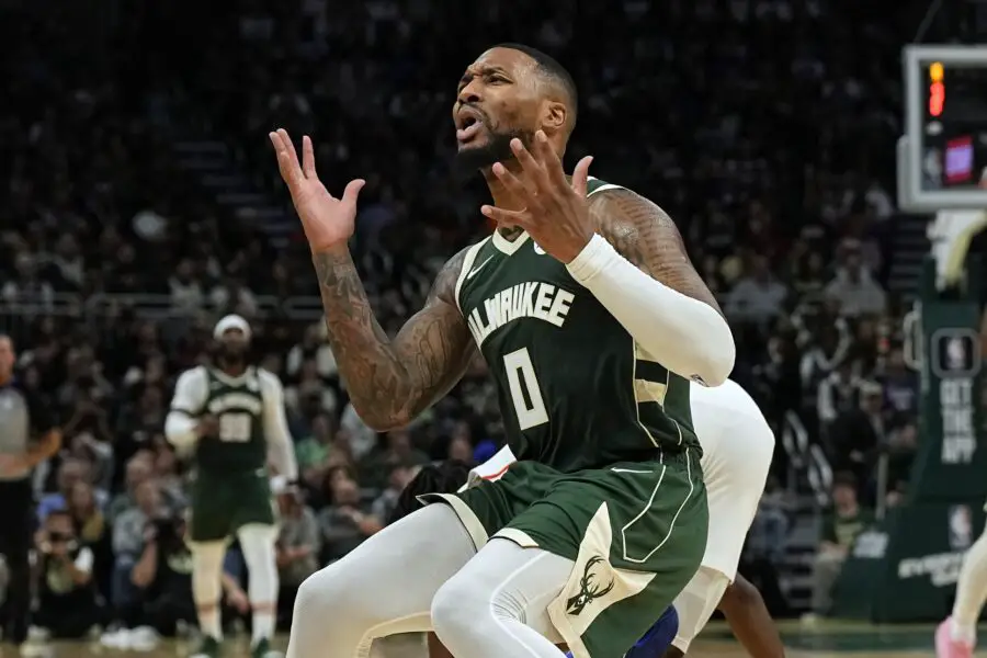 Oct 26, 2023; Milwaukee, Wisconsin, USA; Milwaukee Bucks guard Damian Lillard (0) reacts after being called for a foul during the third quarter against the Philadelphia 76ers at Fiserv Forum. Mandatory Credit: Jeff Hanisch-USA TODAY Sports
