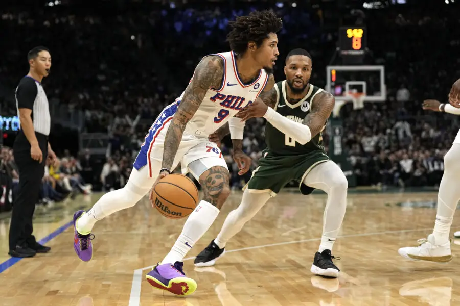 Oct 26, 2023; Milwaukee, Wisconsin, USA; Philadelphia 76ers forward Kelly Oubre Jr. (9) drives for the basket against Milwaukee Bucks guard Damian Lillard (0) during the fourth quarter at Fiserv Forum. Mandatory Credit: Jeff Hanisch-USA TODAY Sports