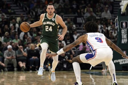 Oct 26, 2023; Milwaukee, Wisconsin, USA; Milwaukee Bucks guard Pat Connaughton (24) brings the ball up court as Philadelphia 76ers forward Kelly Oubre Jr. (9) defends during the second quarter at Fiserv Forum. Mandatory Credit: Jeff Hanisch-USA TODAY Sports