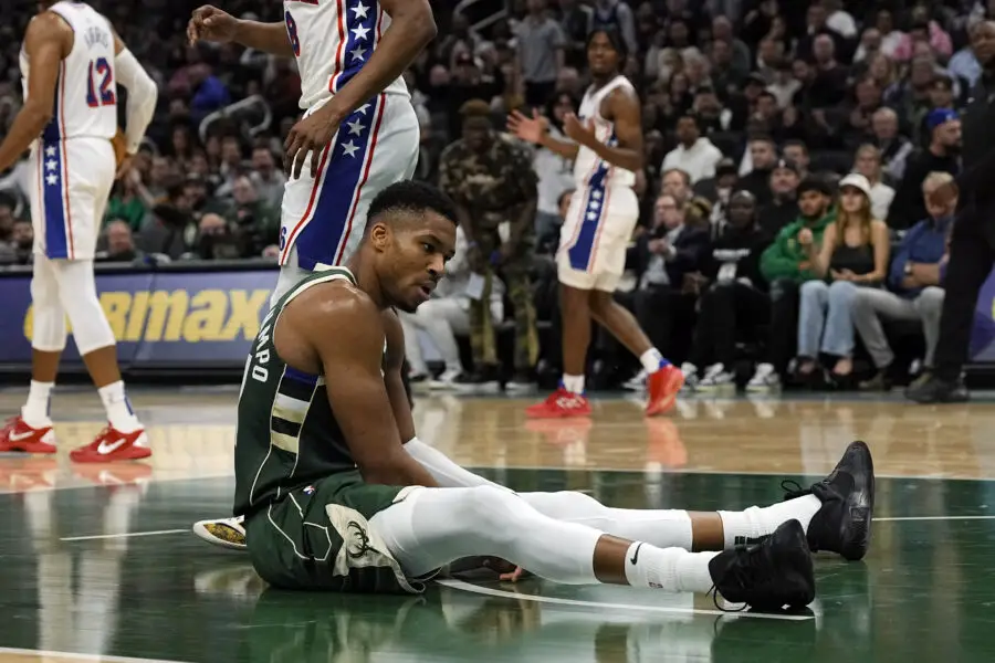 Oct 26, 2023; Milwaukee, Wisconsin, USA; Milwaukee Bucks forward Giannis Antetokounmpo (34) sits on the court after being fouled during the second quarter against the Philadelphia 76ers at Fiserv Forum. Mandatory Credit: Jeff Hanisch-USA TODAY Sports