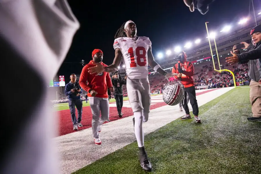 Oct 28, 2023; Madison, Wisconsin, USA; Ohio State Buckeyes wide receiver Marvin Harrison Jr. (18) gets high fives as he leaves the field following the NCAA football game against the Wisconsin Badgers at Camp Randall Stadium. Ohio State won 24-10. (Green Bay Packers)