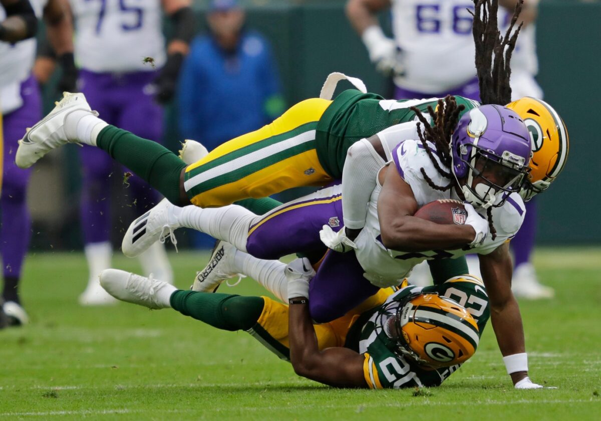 Minnesota Vikings wide receiver K.J. Osborn (17) dives for a first down on a reception against Green Bay Packers linebacker De'Vondre Campbell (59) and safety Rudy Ford (20) during their football game Sunday, October 29, 2023, at Lambeau Field in Green Bay, Wis. Dan Powers/USA TODAY NETWORK-Wisconsin.