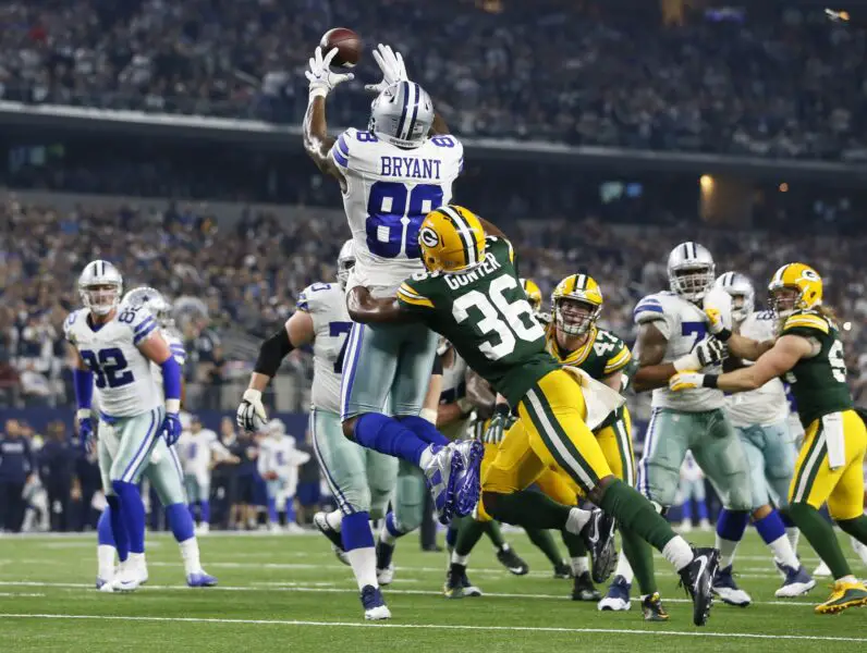 Jan 15, 2017; Arlington, TX, USA; Dallas Cowboys wide receiver Dez Bryant (88) catches a touchdown against Green Bay Packers cornerback LaDarius Gunter (36) during the fourth quarter in the NFC Divisional playoff game at AT&T Stadium. Mandatory Credit: Tim Heitman-USA TODAY Sports
