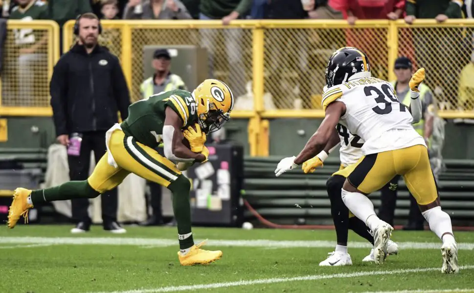 Oct 3, 2021; Green Bay, Wisconsin, USA; Green Bay Packers wide receiver Randall Cobb (18) scores a touchdown against Pittsburgh Steelers safety Minkah Fitzpatrick (39) in the second quarter at Lambeau Field. Mandatory Credit: Benny Sieu-USA TODAY Sports