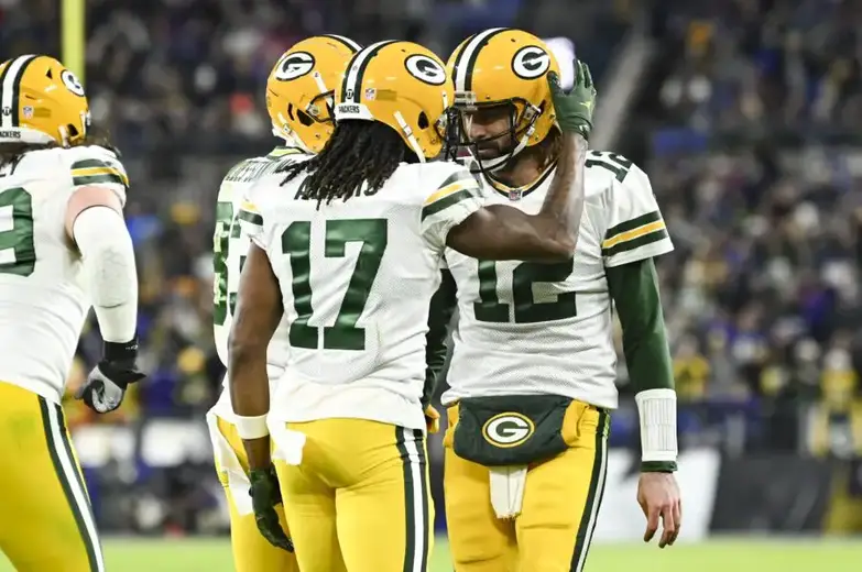 Dec 19, 2021; Baltimore, Maryland, USA; Green Bay Packers wide receiver Davante Adams (17) celebrates with quarterback Aaron Rodgers (12) after scoring a second quarter touchdown against the Baltimore Ravens at M&T Bank Stadium. Mandatory Credit: Tommy Gilligan-USA TODAY Sports (New York Jets)