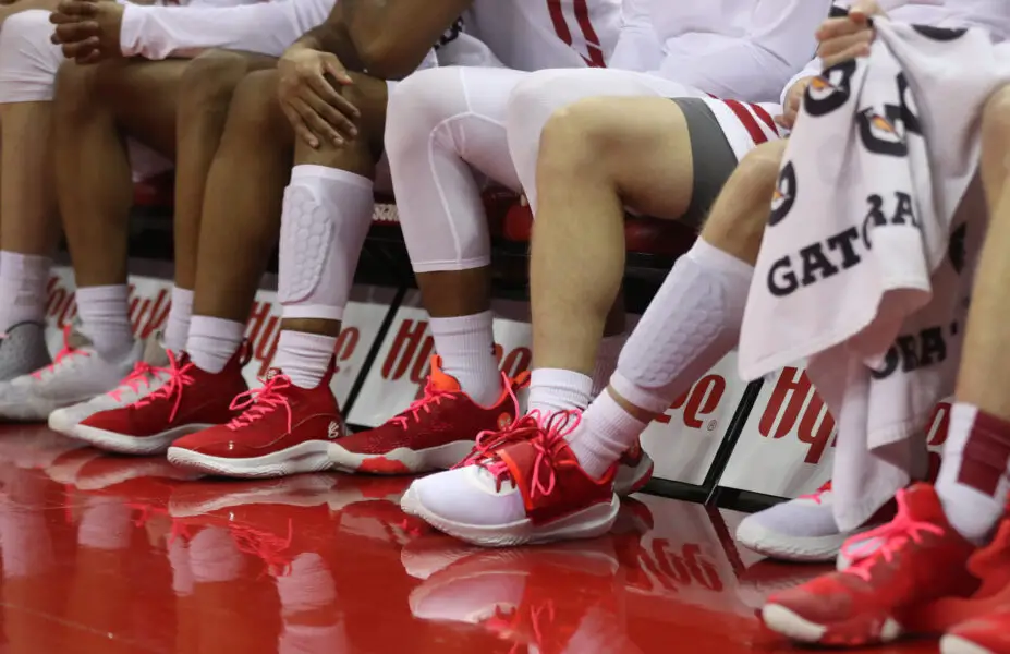 View of Wisconsin Badgers basketball players' shoes on the bench