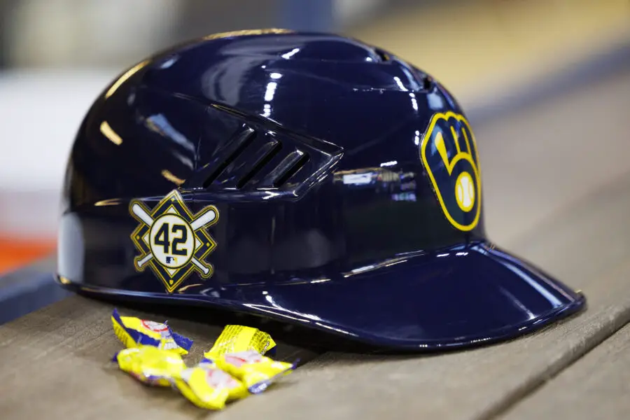 Apr 15, 2022; Milwaukee, Wisconsin, USA; A Milwaukee Brewers batting helmet sits in the dugout showing the Jackie Robinson Number 42 prior to the game against the St. Louis Cardinals at American Family Field. Mandatory Credit: Jeff Hanisch-USA TODAY Sports