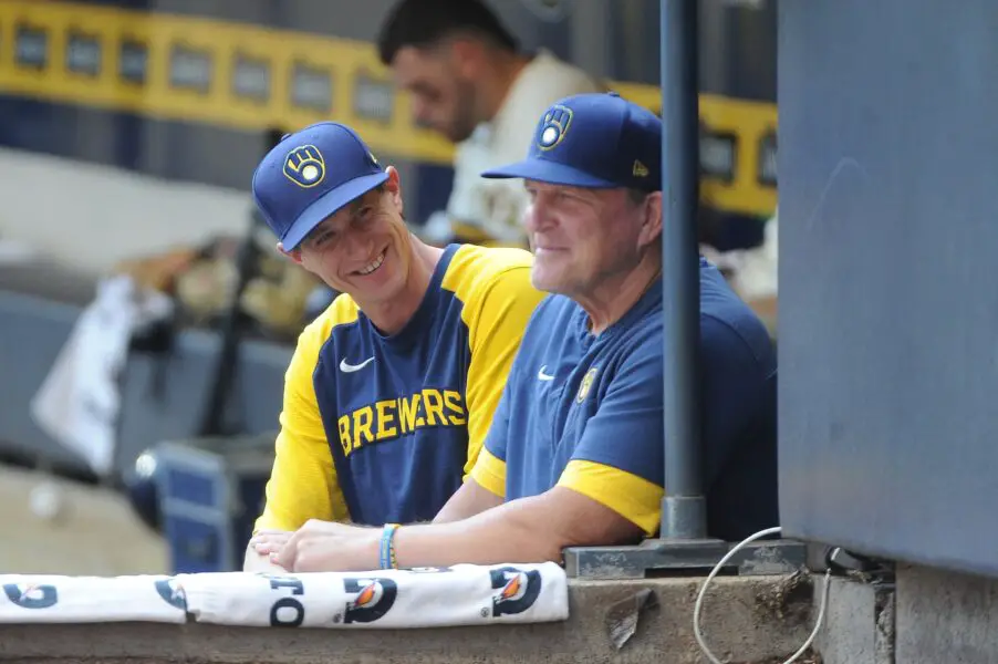 Aug 10, 2022; Milwaukee, Wisconsin, USA; Milwaukee Brewers manager Craig Counsell (30) and bench coach Pat Murphy (00) share a laugh in the dugout in the first inning against the Tampa Bay Rays at American Family Field. Mandatory Credit: Michael McLoone-USA TODAY Sports