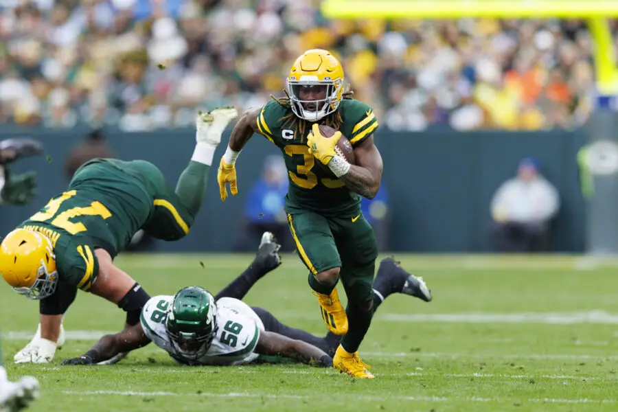 Oct 16, 2022; Green Bay, Wisconsin, USA; Green Bay Packers running back Aaron Jones (33) rushes with the football during the third quarter against the New York Jets at Lambeau Field. Mandatory Credit: Jeff Hanisch-USA TODAY Sports