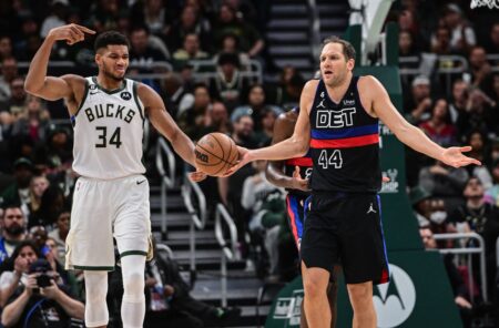Nov 2, 2022; Milwaukee, Wisconsin, USA; Detroit Pistons forward Bojan Bogdanovic (44) reacts after being called for an offensive foul as Milwaukee Bucks forward Giannis Antetokounmpo (34) looks on the in the second quarter at Fiserv Forum. Mandatory Credit: Benny Sieu-USA TODAY Sports