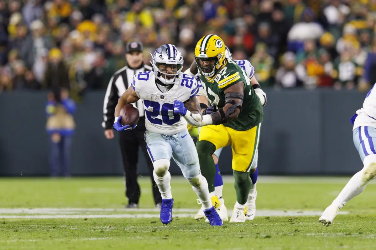 Nov 13, 2022; Green Bay, Wisconsin, USA; Dallas Cowboys running back Tony Pollard (20) rushes with the football during the second quarter against the Green Bay Packers at Lambeau Field. Mandatory Credit: Jeff Hanisch-USA TODAY Sports