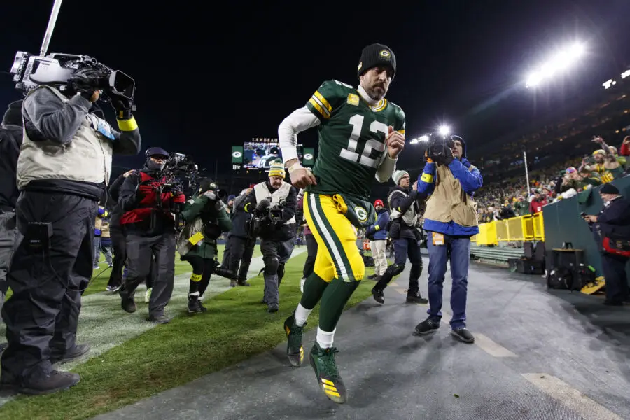 Nov 13, 2022; Green Bay, Wisconsin, USA; Green Bay Packers quarterback Aaron Rodgers (12) runs off the field following the game against the Dallas Cowboys at Lambeau Field. Mandatory Credit: Jeff Hanisch-USA TODAY Sports