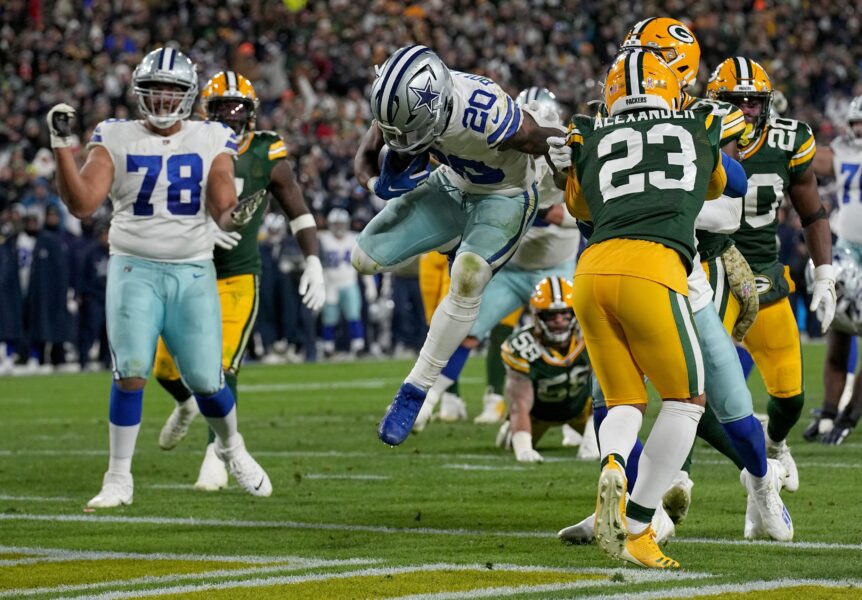 Nov 13, 2022; Green Bay, Wis, USA; Dallas Cowboys running back Tony Pollard (20) scores a touchdown on a 13-yard run during the third quarter against the Dallas Cowboys at Lambeau Field. The Packers defeated the Cowboys 31-28 in overtime. Mandatory Credit: Mark Hoffman/Milwaukee Journal Sentinal/USA Today Sports (Aaron Jones)