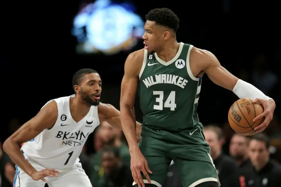 Feb 28, 2023; Brooklyn, New York, USA; Milwaukee Bucks forward Giannis Antetokounmpo (34) controls the ball against Brooklyn Nets forward Mikal Bridges (1) during the second quarter at Barclays Center. Mandatory Credit: Brad Penner-USA TODAY Sports