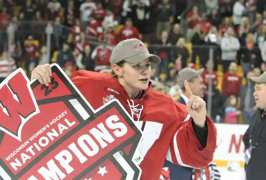 Former Wisconsin hockey goaltender Cami Kronish celebrates winning the national championship