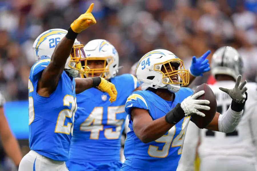 Oct 1, 2023; Inglewood, California, USA; Los Angeles Chargers linebacker Chris Rumph II (94) celebrates after recovering the ball against the Las Vegas Raiders during the first half at SoFi Stadium. Mandatory Credit: Gary A. Vasquez-USA TODAY Sports (Green Bay Packers)