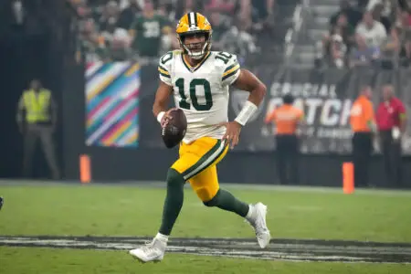 Oct 9, 2023; Paradise, Nevada, USA; Green Bay Packers quarterback Jordan Love (10) carries the ball against the Las Vegas Raiders in the second half at Allegiant Stadium. Mandatory Credit: Kirby Lee-USA TODAY Sports