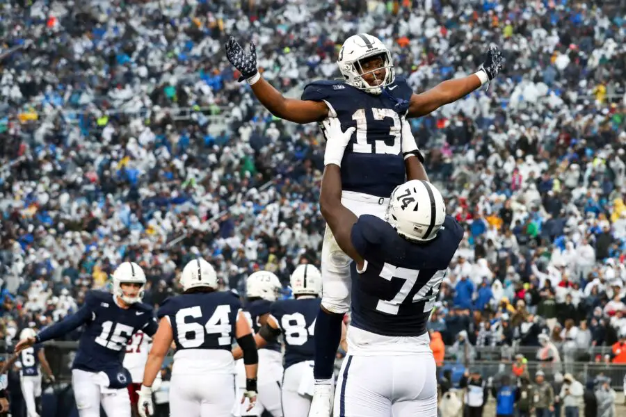 Oct 14, 2023; University Park, Pennsylvania, USA; Penn State Nittany Lions running back Kaytron Allen (13) celebrates with offensive linesman Olumuyiwa Fashanu (74) after scoring a touchdown during the second quarter against the Massachusetts Minutemen at Beaver Stadium. Mandatory Credit: Matthew O'Haren-USA TODAY Sports (Green Bay Packers)