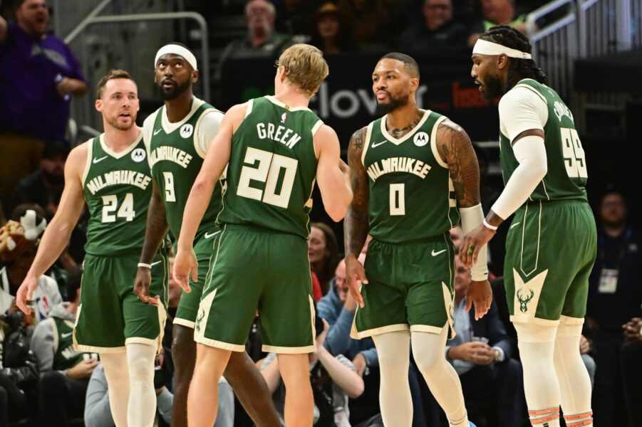 Oct 30, 2023; Milwaukee, Wisconsin, USA; Milwaukee Bucks guard Damian Lillard (0) stands with teammates after scoring a foal in the third quarter against the Miami Heat at Fiserv Forum. Mandatory Credit: Benny Sieu-USA TODAY Sports