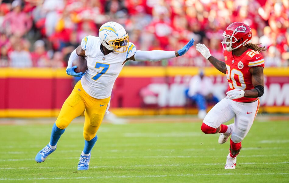 Oct 22, 2023; Kansas City, Missouri, USA; Los Angeles Chargers tight end Gerald Everett (7) runs with the ball against Kansas City Chiefs safety Justin Reid (20) during the first half at GEHA Field at Arrowhead Stadium. Mandatory Credit: Jay Biggerstaff-USA TODAY Sports (Green Bay Packers)