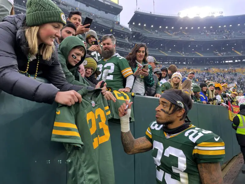Nov 5, 2023; Green Bay, Wisconsin, USA; Green Bay Packers cornerback Jaire Alexander (23) signs autographs for fans after their game against the Los Angeles Rams at Lambeau Field. Mandatory Credit: Mark Hoffman-USA TODAY Sports