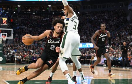 Nov 8, 2023; Milwaukee, Wisconsin, USA; Detroit Pistons guard Cade Cunningham (2) drives to the basket against Milwaukee Bucks forward Giannis Antetokounmpo (34) in the first half at Fiserv Forum. Mandatory Credit: Michael McLoone-USA TODAY Sports