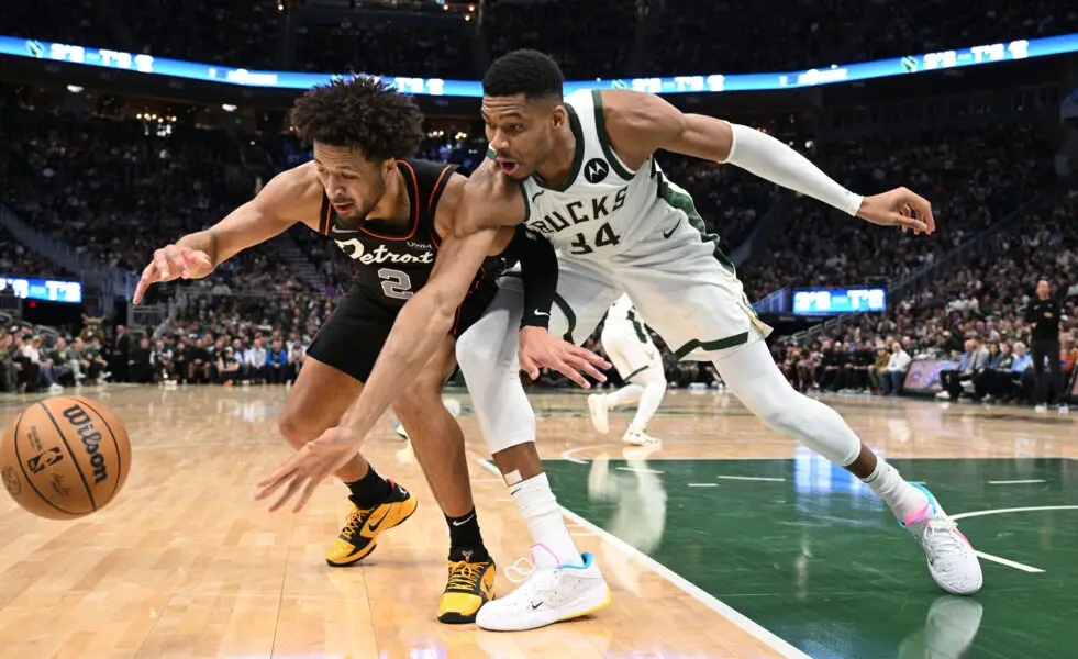 Nov 8, 2023; Milwaukee, Wisconsin, USA; Detroit Pistons guard Cade Cunningham (2) and Milwaukee Bucks forward Giannis Antetokounmpo (34) battle for possession of the ball in the first half at Fiserv Forum. Mandatory Credit: Michael McLoone-USA TODAY Sports
