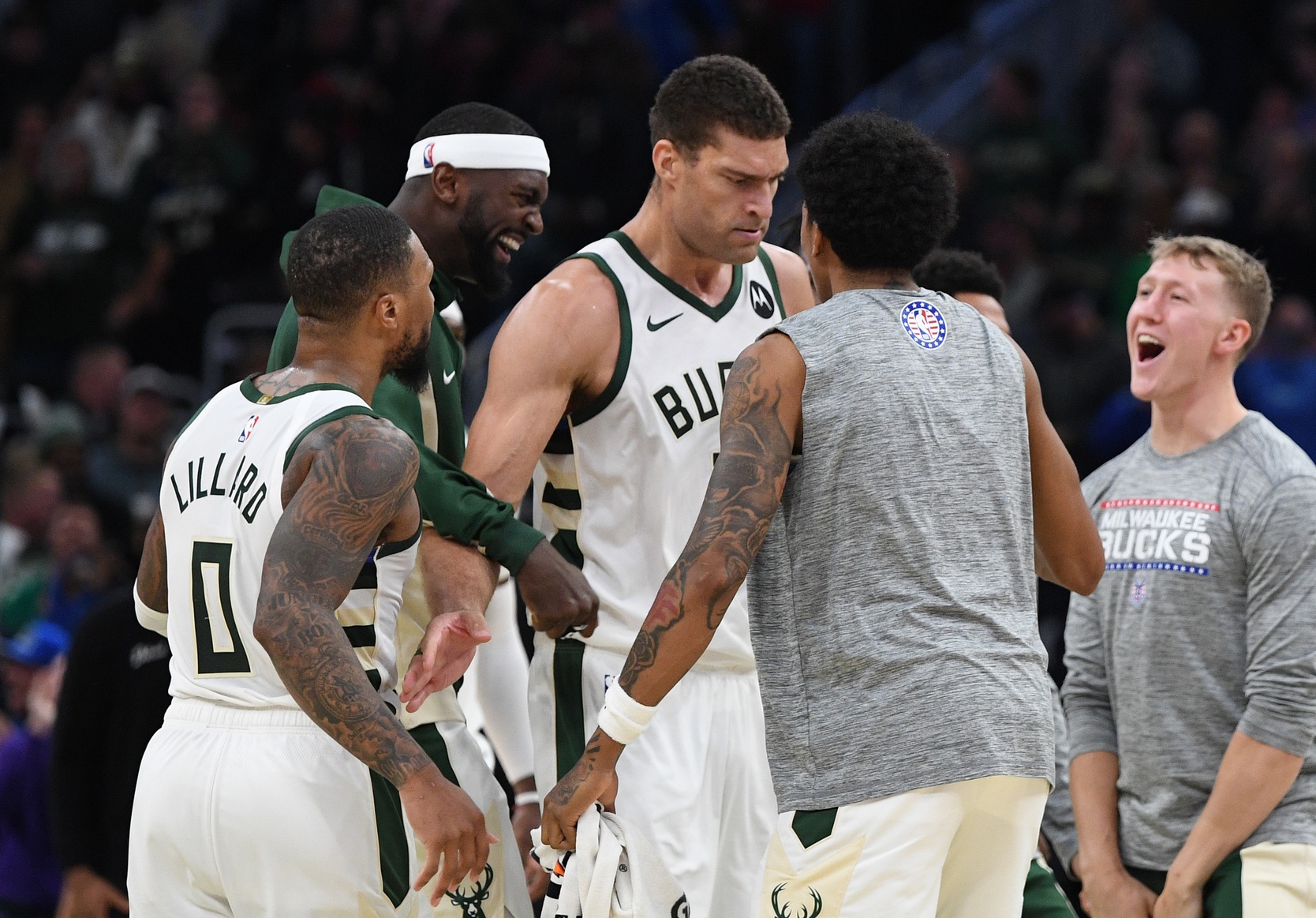 Nov 8, 2023; Milwaukee, Wisconsin, USA; Milwaukee Bucks player celebrate a made three-point shot by Milwaukee Bucks center Brook Lopez (11), center, against the Detroit Pistons in the second half at Fiserv Forum. Mandatory Credit: Michael McLoone-USA TODAY Sports