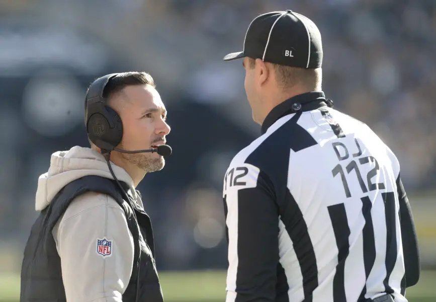 Nov 12, 2023; Pittsburgh, Pennsylvania, USA; Green Bay Packers head coach Matt LaFleur (left) talks with down judge Brian Sakowski (112) against the Pittsburgh Steelers during the second quarter at Acrisure Stadium. Mandatory Credit: Charles LeClaire-USA TODAY Sports