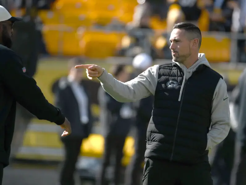 Nov 12, 2023; Pittsburgh, Pennsylvania, USA; Green Bay Packers head coach Matt LaFleur points to Pittsburgh Steelers head coach Mike Tomlin (left) before their game at Acrisure Stadium. Mandatory Credit: Philip G. Pavely-USA TODAY Sports