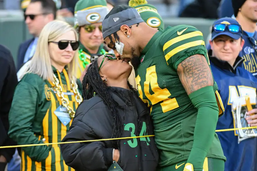 Nov 19, 2023; Green Bay, Wisconsin, USA; Green Bay Packers safety Jonathan Owens (34) kisses his wife, Olympic gymnast Simone Biles, before game against the Los Angeles Chargers at Lambeau Field. Mandatory Credit: Benny Sieu-USA TODAY Sports