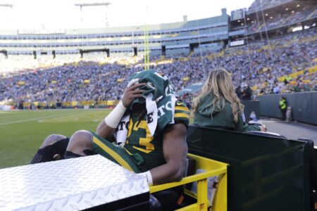 Nov 19, 2023; Green Bay, Wisconsin, USA; Green Bay Packers running back Aaron Jones (33) is carted off the field after getting injured in the second quarter against the Los Angeles Chargers at Lambeau Field. Mandatory Credit: Dan Powers-USA TODAY Sports