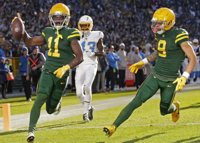 Nov 19, 2023; Green Bay, Wisconsin, USA; Green Bay Packers wide receiver Jayden Reed (11 rushes for a touchdown against the Los Angeles Chargers at Lambeau Field. Mandatory Credit: Wm. Glasheen-USA TODAY Sports